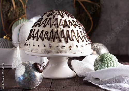 Obraz na płótnie Pancho cake made of chocolate biscuit with sour cream and pineapple in New Year's or Christmas decoration. Rustic style. w salonie