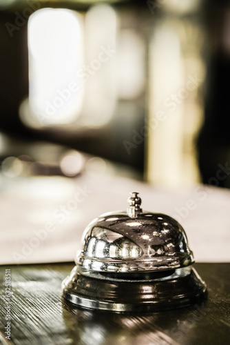 Service bell to call staff on blurred background with copy space