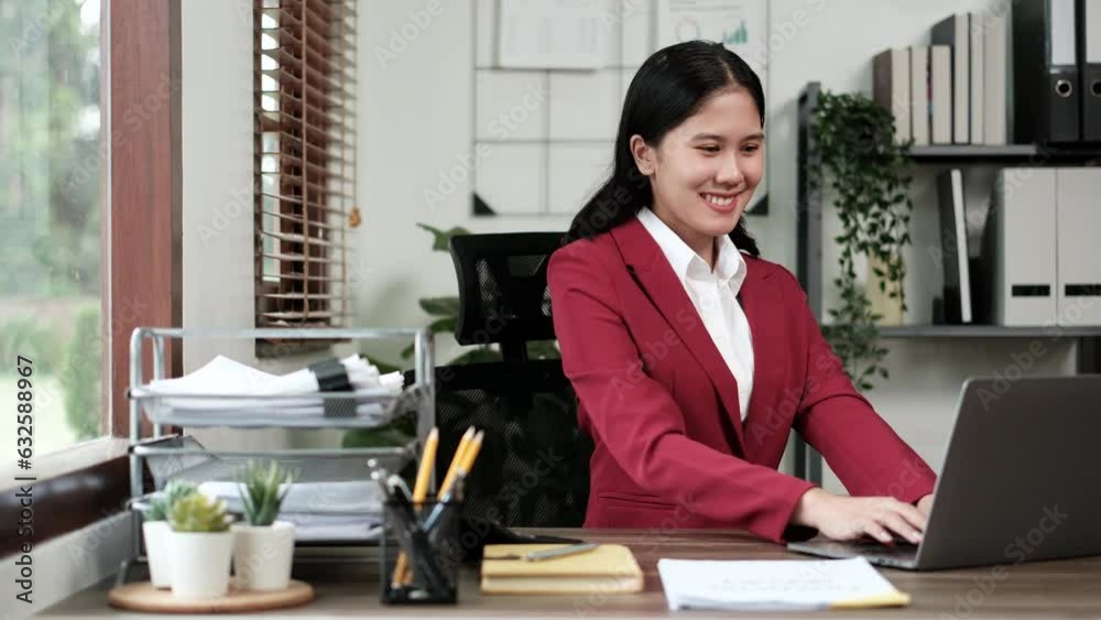 Business woman using laptop for doing finance on an office desk, tax, report, accounting, statistics, and analytical research concept in office Business woman using laptop for doing finance on an office desk, tax, report, accounting, statistics, and analytical research concept in office