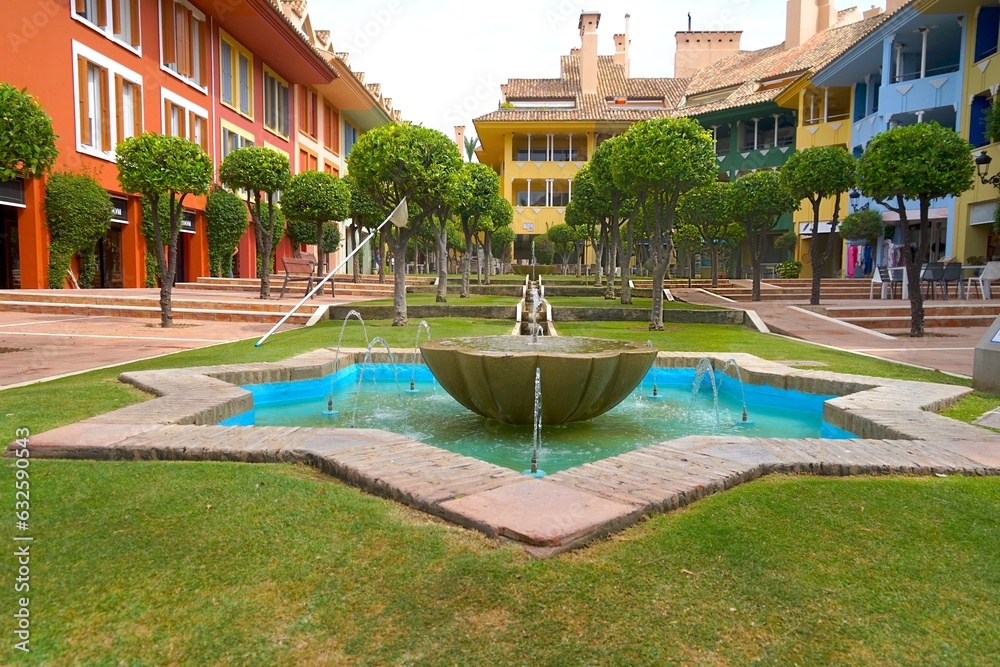 square with fountain and colorful houses in Sotogrande at the Mediterranean Sea, Cádiz, Andalusia, Malaga, Spain