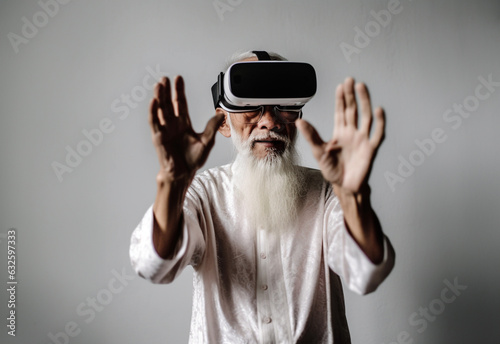 Senior having fun with virtual reality glasses Old man using new vr headset - Concept of active elderly and interaction with new technologies © suthiwan