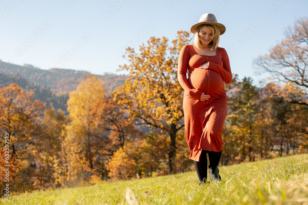 Pregnant woman outdoor touch her belly Pregnant woman outdoor touch her belly