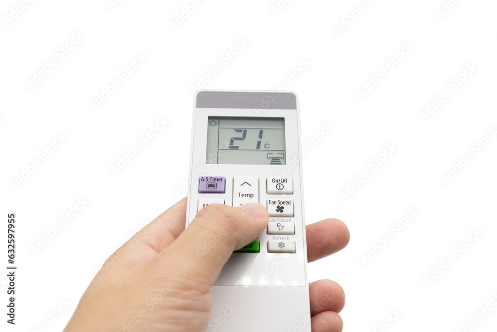 Hand holding air conditioner controller with buttons and display on isolated background.