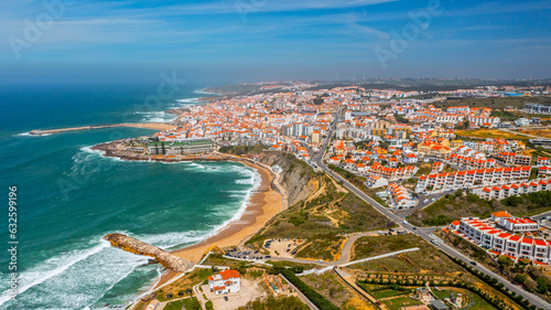 Fototapeta Naklejka Na Ścianę i Meble -  Drone aerial view over beaches, coastlines in Ericeira, Portugal, on summer sunny day. Aerial view to the Beautiful European touristic town. Beautiful cityscape with skyline, ocean rocky shore