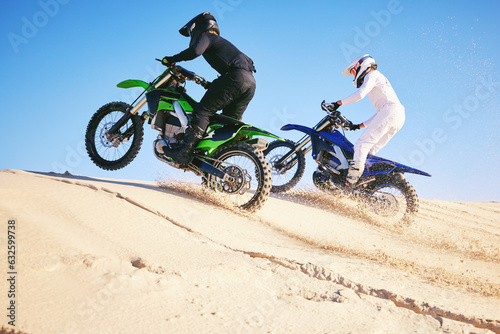 Motorcycle, desert dune and fast in race, contest or outdoor hill climb for performance, goal or off road. Motorbike athlete, launch or ramp in nature, sand or speed for training in summer sunshine © Azee/peopleimages.com