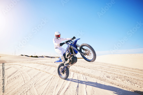 Canvas Print Sand, motorbike balance and sports person doing trick, skill or stunt on off road challenge, training and freestyle competition