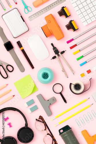 Back to school, stationary flat lay on pink background
