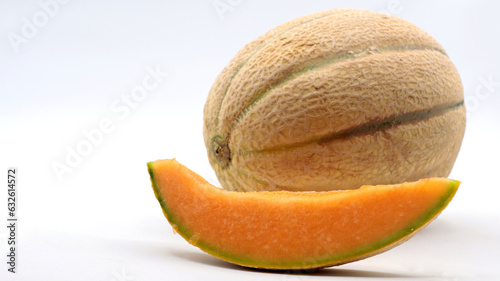 close-up of a melon with a slice next to it, on a white background