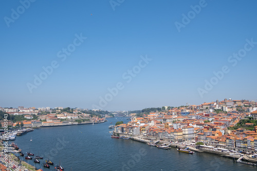 Fototapeta Naklejka Na Ścianę i Meble -  The Douro sings its eternal song in the crystalline view of Porto, a dance of lights and emotions in its waters.