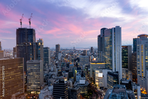 sunset or sun rise of Osaka cityscape with Skyline and office building and downtown of Osaka with twilight sky in summer season