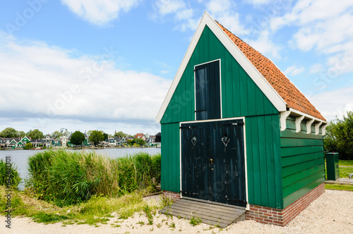 Green timbered building at De Zaanse Schans windmill village photo