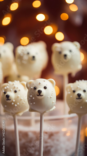Adorable White Chocolate Polar Bear Cake Pops shaped like bear heads. Vertical, close-up, side view.