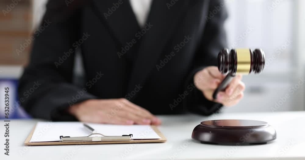 Judge writing in documents on clipboard and knocking with wooden gavel 4k movie. Consideration of administrative and criminal cases concept Judge writing in documents on clipboard and knocking with wooden gavel 4k movie. Consideration of administrative and criminal cases concept