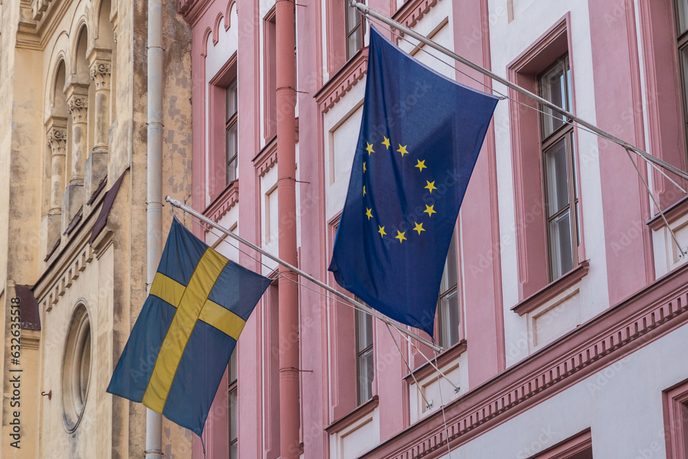 Flag of Sweden and the European Union hang on the building