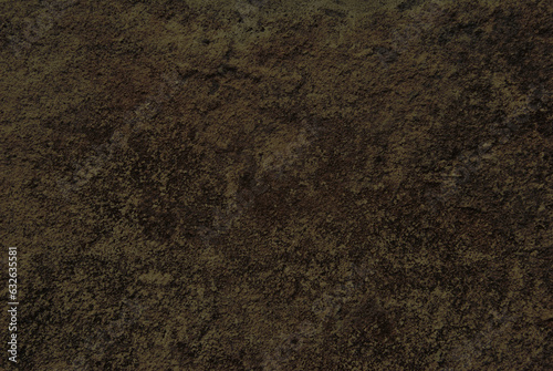A texture of old dark brown stone surface close up as background