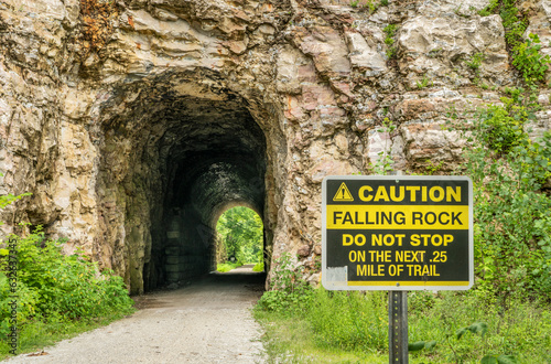 MKT tunnel on Katy Trail at Rocheport, Missouri with a falling rocks warning sign. 237 mile bike trail stretching across the state of Missouri is converted from an old railroad. photo