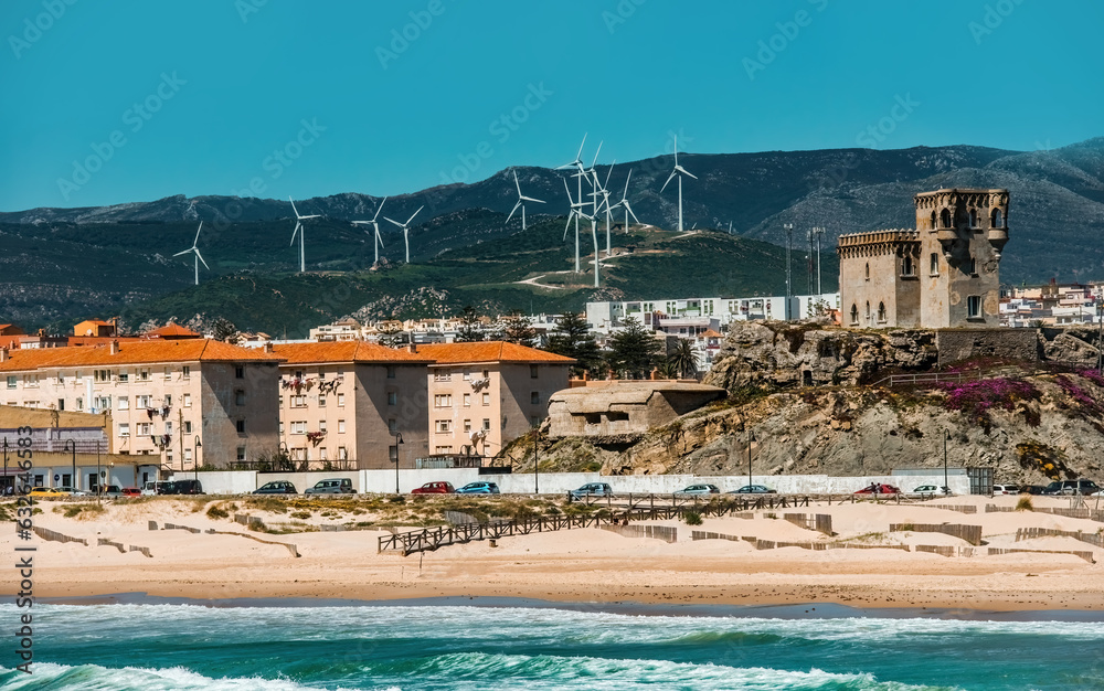 Seashore of Tarifa in Spain, Modern buildings and Old Castle of Guzman El Bueno, view on the beach