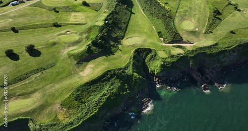  Golf course on a rocky bluff near the ocean 4k photo