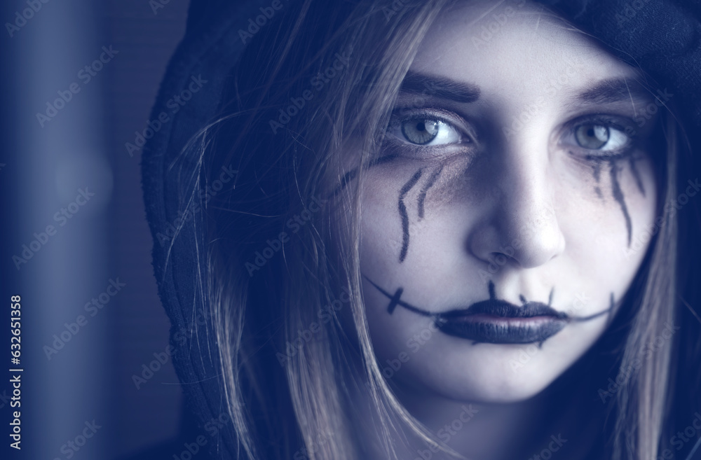 Little girl with spooky Halloween makeup looking at camera. Creepy kid's portrait. Little girl with spooky Halloween makeup looking at camera. Creepy kid's portrait.