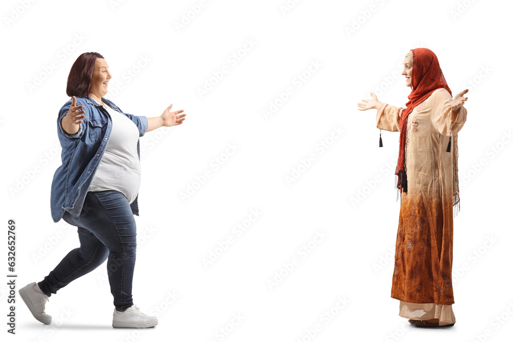 Overweight woman meeting and greeting a muslum young woman Overweight woman meeting and greeting a muslum young woman
