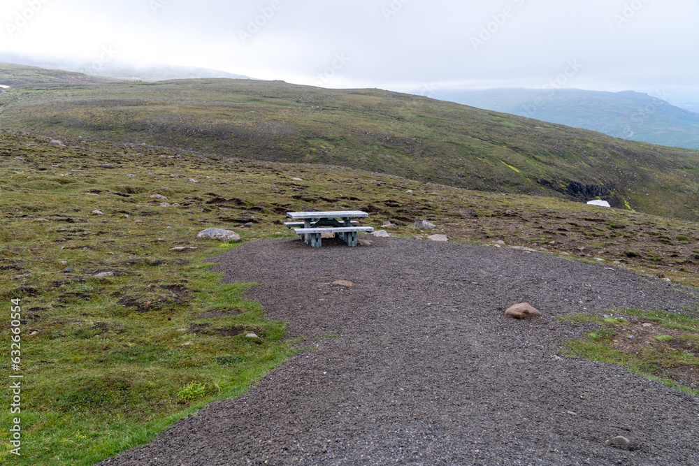 Fototapeta premium Roadside rest area in Iceland, with a picnic table, on a hill