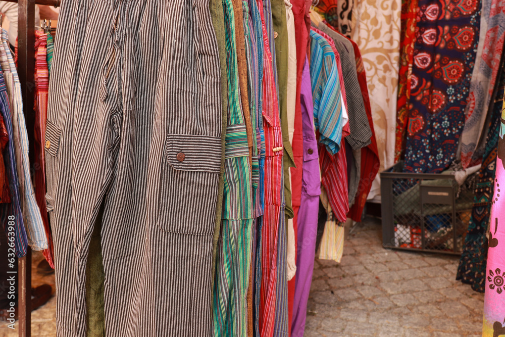 Multicolored clothes and fabrics in an arabic market