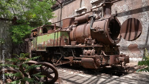 Old locomotive from Beirut–Damascus covered by plants Beqaa Rayak Lebanon photo