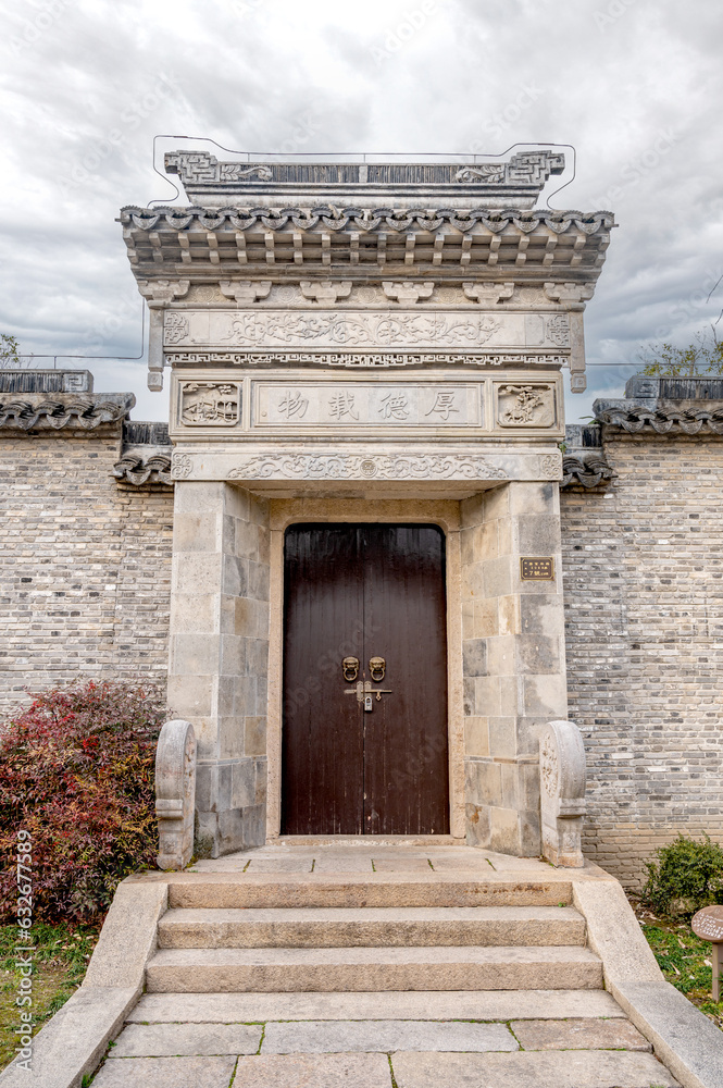 Fototapeta premium Traditional Chinese folk building stone courtyard gate