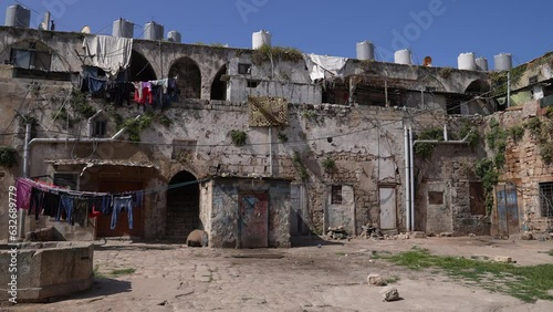 Old caravanserai occupied by poor people North Governorate Tripoli Lebanon photo