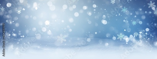 Winter snow background with snowdrifts, with beautiful light and snow flakes on the blue sky, beautiful bokeh circles, banner format, copy space © Eli Berr