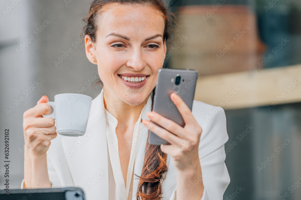 business woman with mobile phone drinking coffee business woman with mobile phone drinking coffee