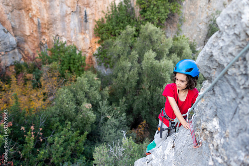 climber boy. the child trains in rock climbing.