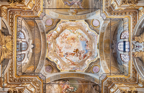 Fototapeta GENOVA, ITALY - MARCH 6, 2023: The cupola wiht fresco Triumph of the Cross  in the church Chiesa di Santa Croce by Giorgio e Lorenzo da Ferrari from 17