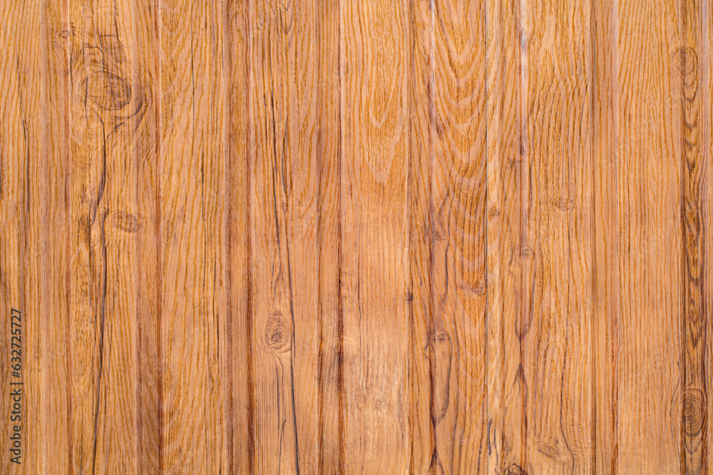 Surface made of wooden boards processed arranged vertically, close-up, uniform texture background