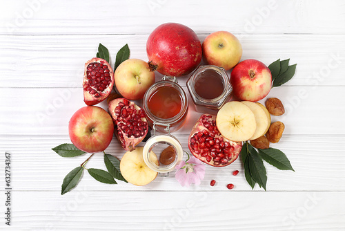 Autumn banner with honey, apples, pomegranates, flowers, dried fruits on a light background with place for text, composition for the Jewish holiday Rosh Hashan, Hello autumn and thanksgiving day 