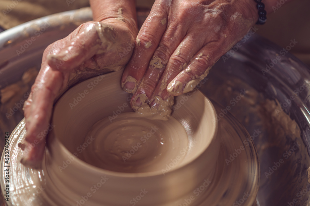 Ceramic plate on a potter's wheel, ceramist's hands. Ceramic plate on a potter's wheel, ceramist's hands.