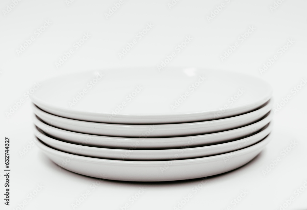 White round plate on white background copy space White round plate on white background copy space