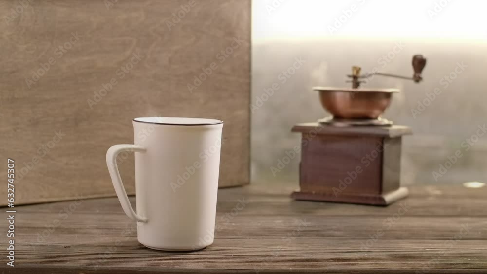 White ceramic coffee cup with threshing machine on background. Start of the day with a big cup of coffee, caffeine addiction White ceramic coffee cup with threshing machine on background. Start of the day with a big cup of coffee, caffeine addiction