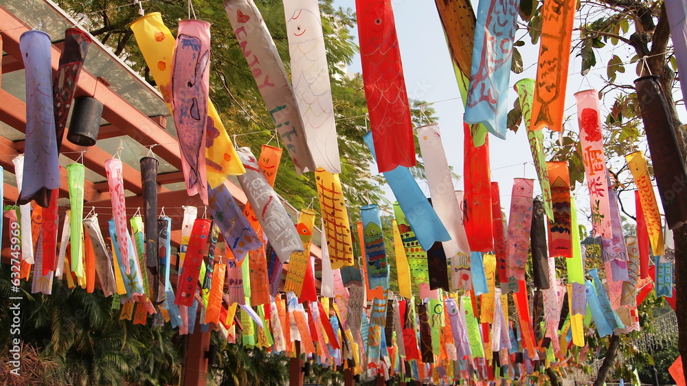 A colorful fish shaped flags hanging by the seaside fishing village in Hong Kong