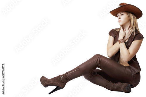 Bild auf Leinwand Girl in leather pants and a hat on her head. Wild West