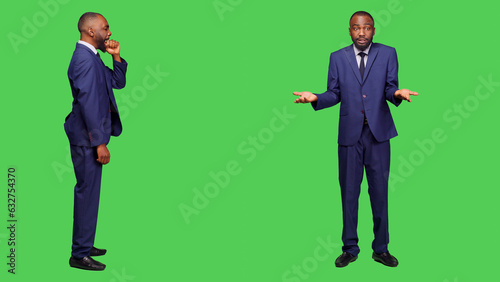Young businessman feeling frustrated and exhausted in studio, yawning over full body greenscreen backdrop. Aggressive tired employee being displeased on camera, falling asleep.