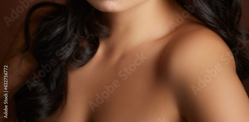 tan women's neck shoulder lips and collarbone on nude brown background 