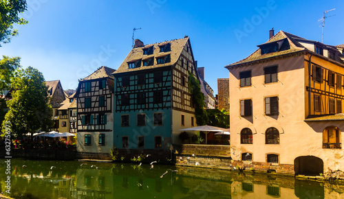 Charming view of residential half-timbered buildings along canals of Strasbourg.