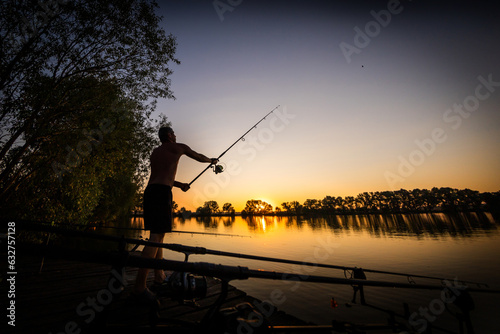 Fishing background. Young man on sunset. 