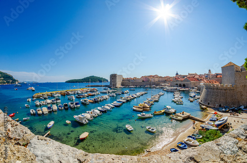 Dubrovnik, Croatia - September 22nd 2015 - Panoramic view of the Porat Dubrovnik, centuries-old pier walls and lookouts around a compact harbor lined with restaurant