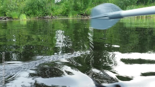 Oar - a special device propulsion in the form of a narrow shovel for setting small vessels in motion by rowing acts on the principle of a lever. Fishing on Lake Lososinnoye, Karelia. Sedge on the photo