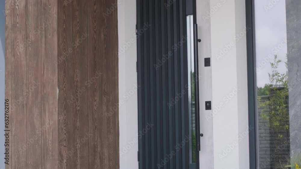 New house with wooden door and empty white wall. New house with wooden door and empty white wall.
