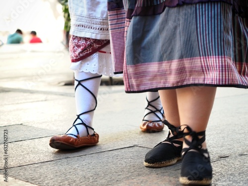 Two people wearing alpargatas and albarcas or abarcas or abarkas vascas, traditional basque footwear  photo