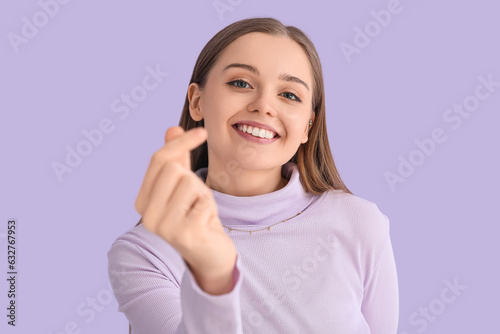 Young woman in sweater snap...