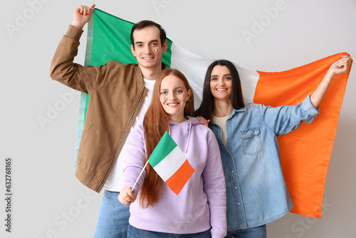 Happy friends with flags of...